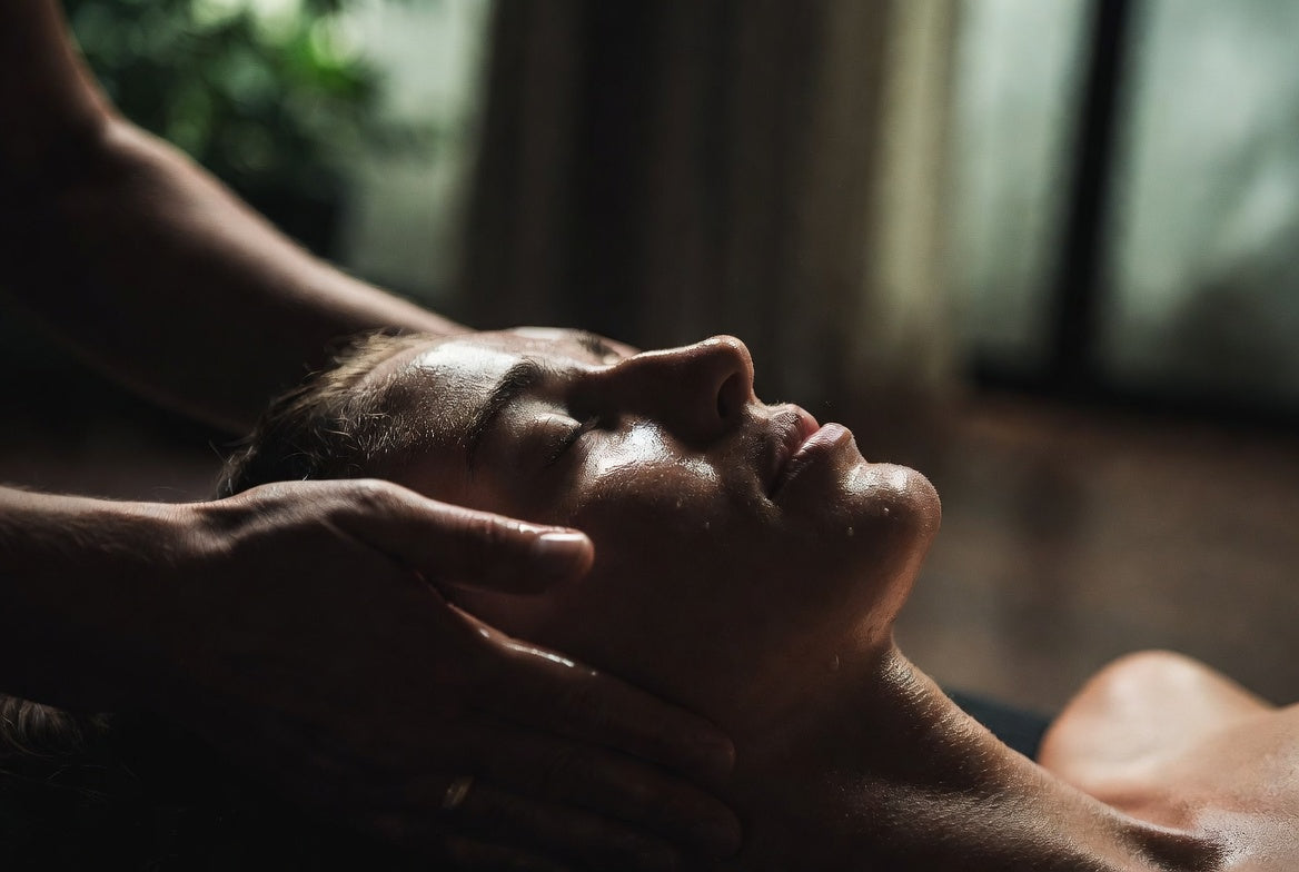 Person receiving a facial massage with a blurred background